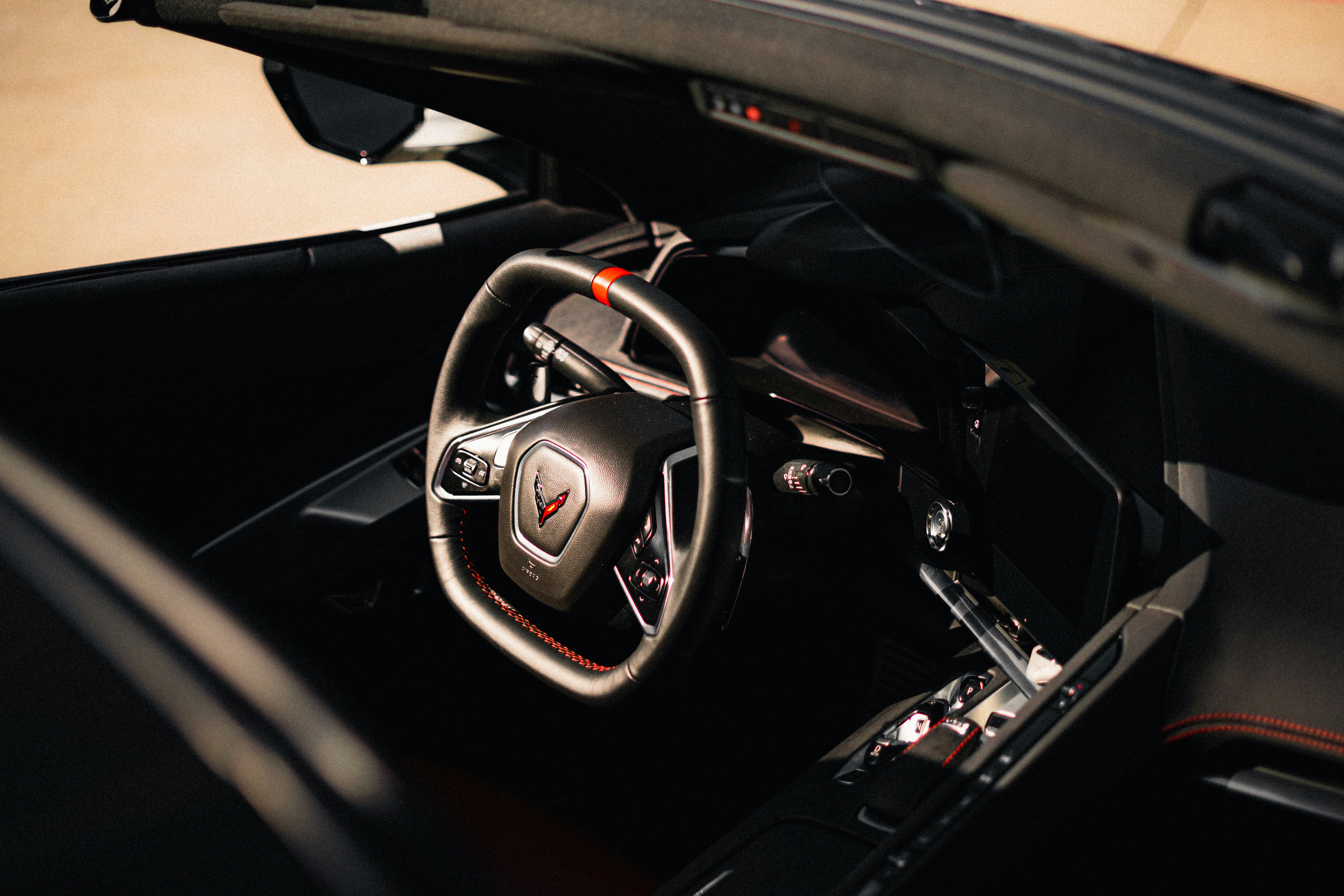 black and red car steering wheel